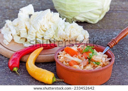 Cooked cabbage with carrot and chili peppers