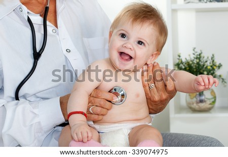 Female doctor pediatrician and patient happy child baby