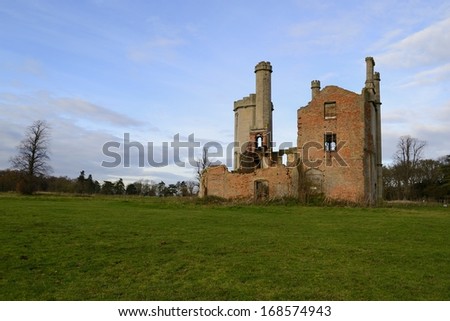 The old ruins of a country home in rural Lincolnshire as the morning sun rises. England.