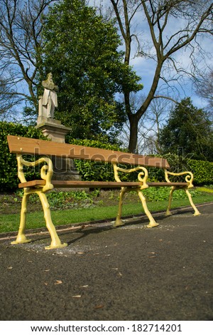 The old style park bench in Queen\'s Park, Bolton, England.