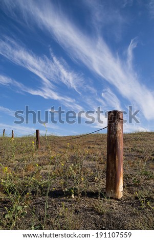 The rusted fence post in the Southern California desert.