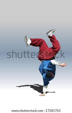 Dancer. Upside-down street dancer performing on a neutral grey background.