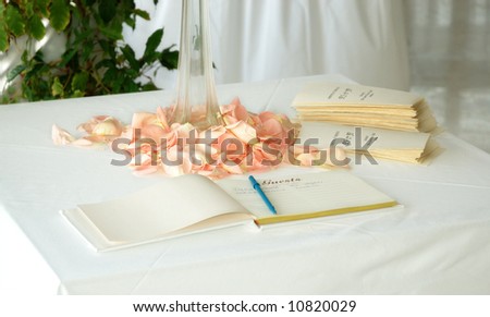 stock photo Wedding guest book and order of service sheets on table with 