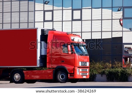 a red truck at warehouse