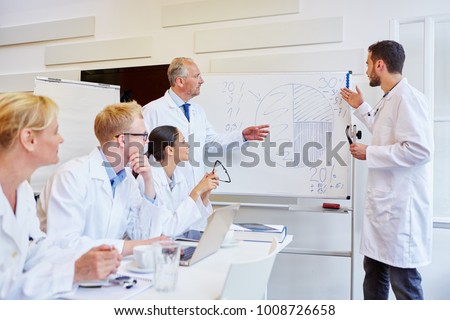 Drug representatives presentating medicine statistics during training analysis