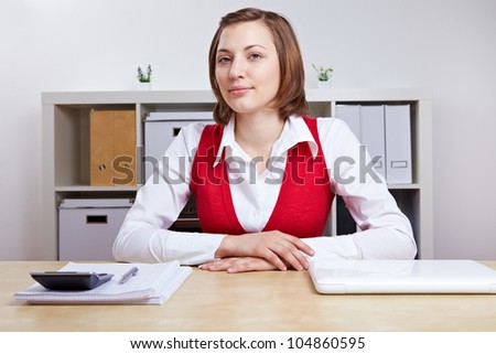 Friendly female Human Resource manager doing job interviews at her desk