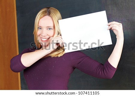 Happy eldery woman holding empty white sign