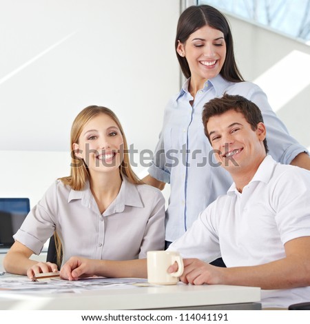 Happy business team working together in an advertising agency