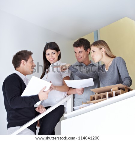 Group of business people arguing in office on a stairway
