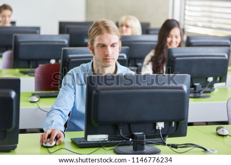 Students learning in computer course lessons in university