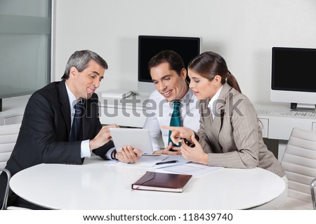 Business tax consultant with tablet computer in a meeting in the office