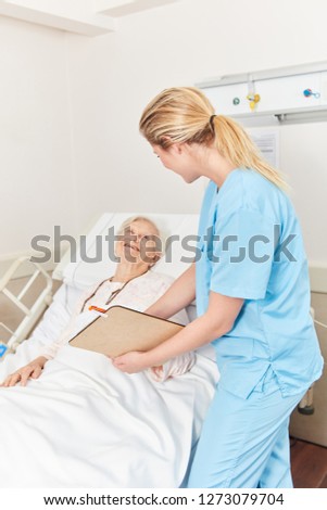 Nurse or nursing assistant on the bed of a patient in nursing home