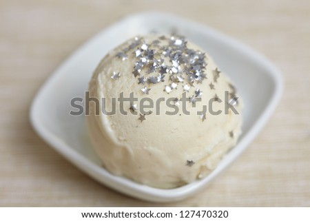 Scoop of homemade Frozen Yoghurt ice cream with edible stars for decoration