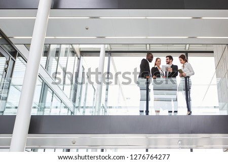 Group of business people at a team meeting in the modern corporate office