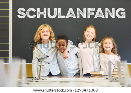 Group of pupils in front of blackboard at the beginning of school