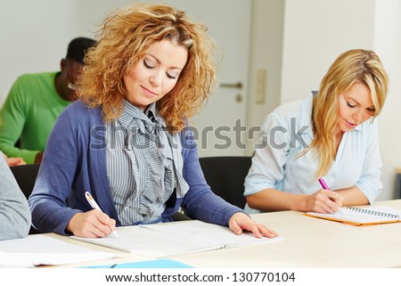 Woman in assessment center taking aptitude test for employee screening