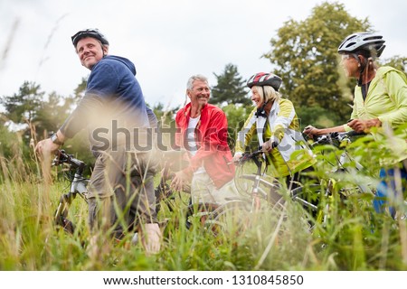 Group of seniors on a bike tour or bike tour as a cycling holiday