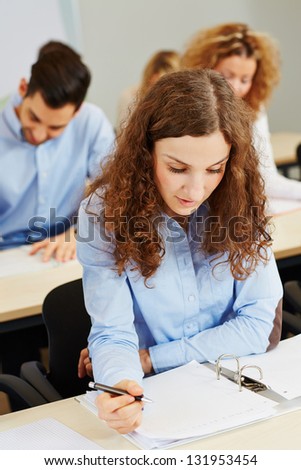 Young woman taking aptitude test in an assessment center