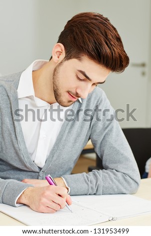 Man taking exam as student in university lecture
