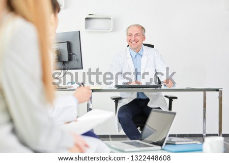 Senior man as executive chief physician in his office