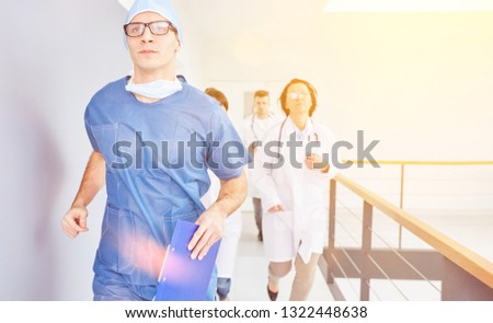 Doctor and team run to emergency in hospital