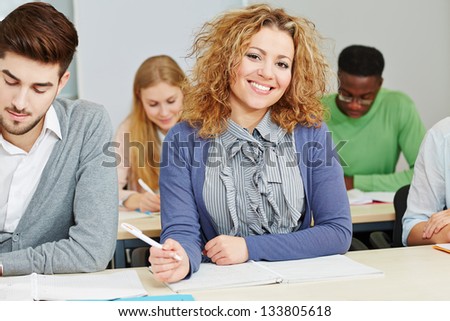 Smiling student in study course in a university
