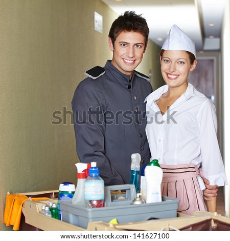Friendliy service staff in hotel with bellboy and hotel maid