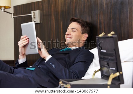 Successful Business Man Working With Tablet Pc In His Hotel Room