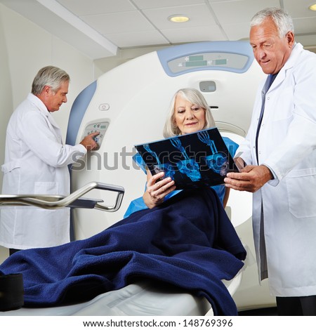 Senior patient getting magnetic resonance tomography in hospital