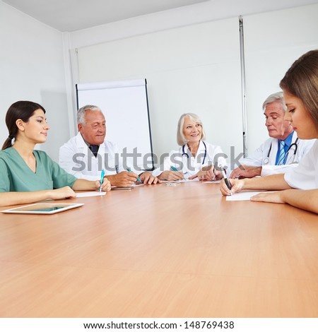 Doctors in a team meeting at a round table