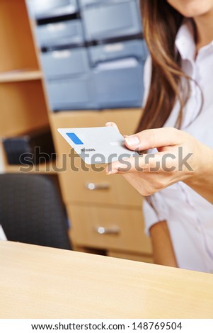 Hand of a nurse holding a smart card in a hospital
