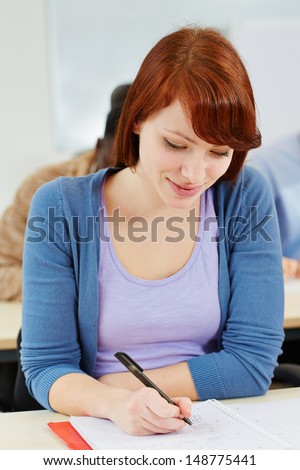 Young woman taking aptitude test in an assessment center