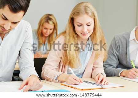Many students learning together in a university lecture
