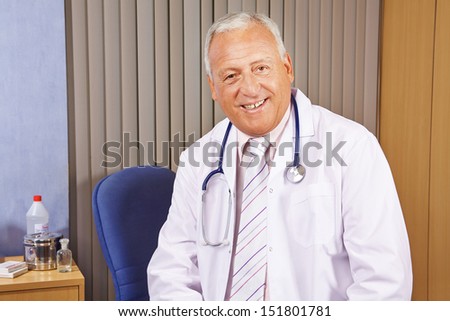 Senior chief physician smiling in his hospital office