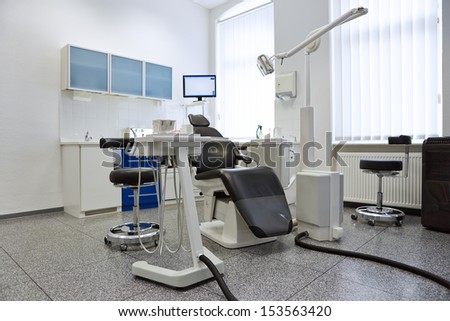 Dentist Chair In Bright Treatment Room In Dental Practice