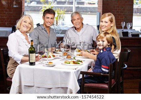 Portrait of a happy smiling family in a restaurant