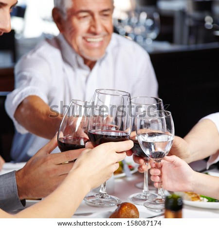 Big happy family eating and drinking together at the table