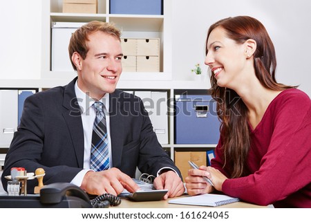 Smiling woman at financial consultation for insurance in the office