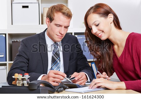 Woman at financial consultation with tax advisor in his office
