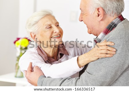 Two Happy Senior Citizens Dancing And Smiling In A Dancing Class