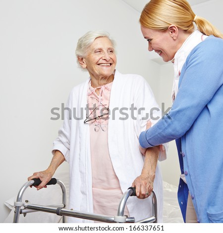 Geriatric nurse helping senior citizen woman with walker