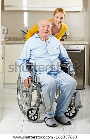 Demented senior man in wheelchair with extended care assistant