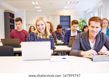 Students Learning With Computers In A University Class