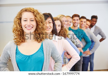 Group of many happy teenager in a row behind each other