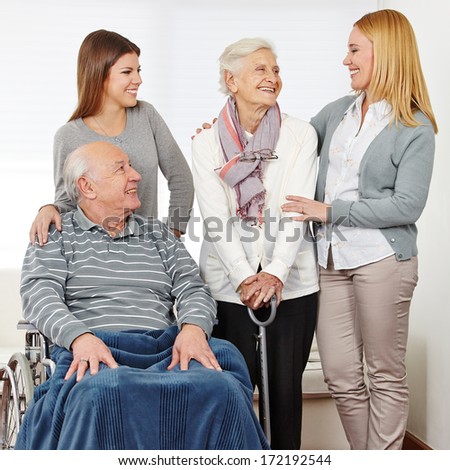 Family with mother and daughter and two senior citizens at home