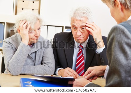 Anxious elderly senior couple worring about financial security at consultation