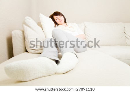 Young woman taking a nap on a couch