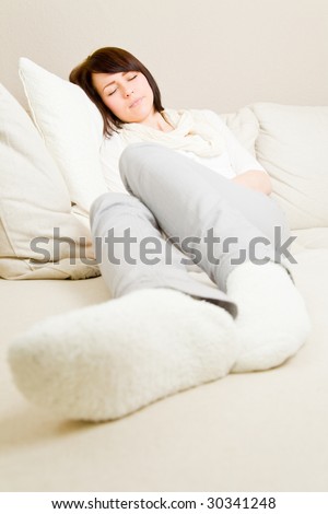 Young woman taking a nap on a couch