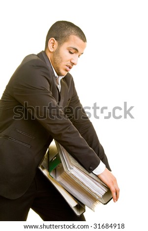 Business man trying to carry heavy files