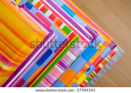 Stack of many colorful christmas gifts on the floor